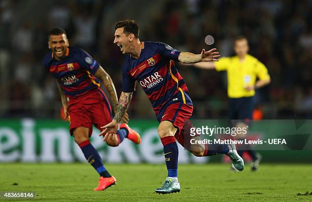 Lionel Messi of Barcelonacelebrates scoring his second goal by team mates during the UEFA Super Cup between Barcelona and Sevilla FC at Dinamo Arena...