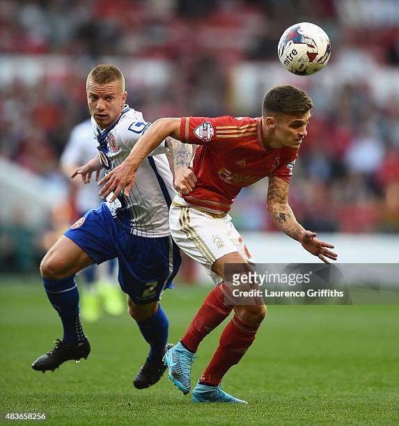 Jamie Paterson of Nottingam Forest battles with Jason Demetriou of Walsall during the Capital One Cup First Round match between Nottingham Forest and...