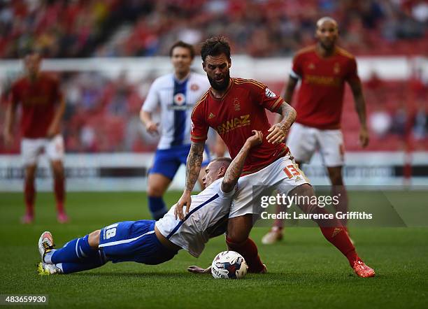 Danny Fox of Nottingam Forest battles with Kieron Morris of Walsall during the Capital One Cup First Round match between Nottingham Forest and...