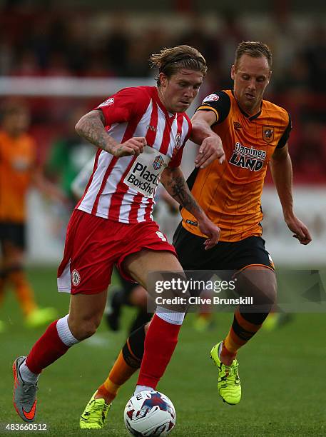 Josh Windass of Accrington Stanley moves away from David Meyler of Hull City during the Capital One Cup First Round match between Accrington Stanley...