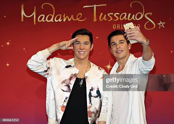 Pop Sensation Austin Mahone meets his new Madame Tussauds Orlando wax figure at Madame Tussauds New York on August 11, 2015 in New York City.