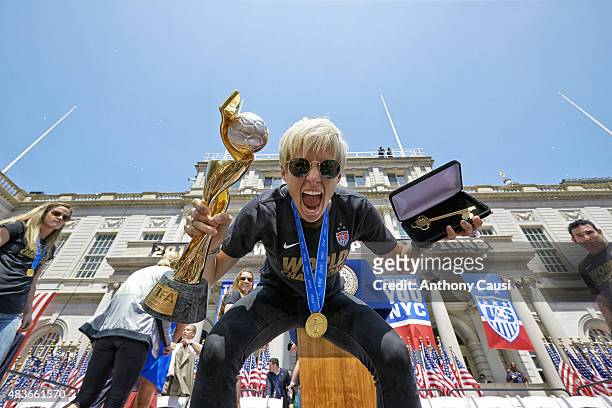 World Cup Championship Ceremony: Megan Rapinoe victorious with FIFA World Cup Trophy and key to the city during Victory Ceremony at City Hall. New...