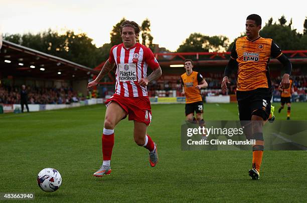 Josh Windass of Accrington Stanley in action with Curtis Davies of Hull City during the Capital One Cup First Round match between Accrington Stanley...