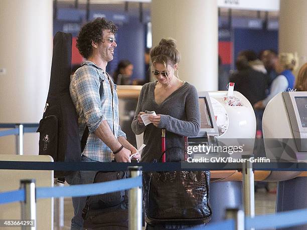 Renee Zellweger and Doyle Bramhall are seen at Los Angeles International Airport on February 15, 2013 in Los Angeles, California.