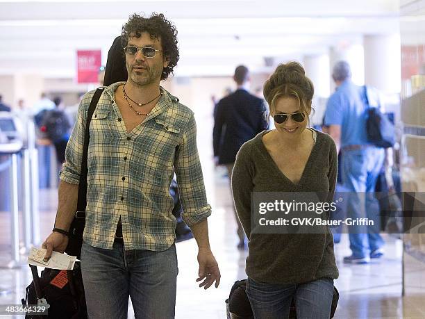 Renee Zellweger and Doyle Bramhall are seen at Los Angeles International Airport on February 15, 2013 in Los Angeles, California.