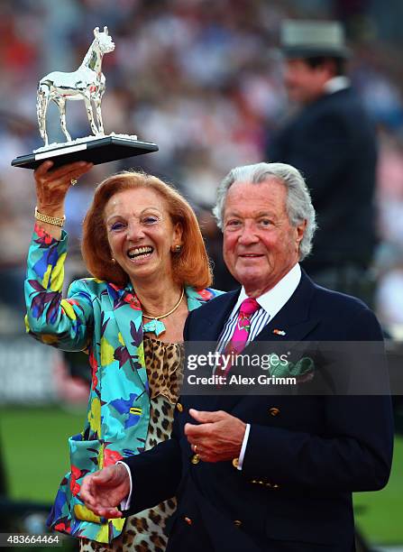 Marina and Toni Meggle pose after being awarded with the Silver Horse during the Opening Ceremony of the FEI European Championship 2015 on August 11,...