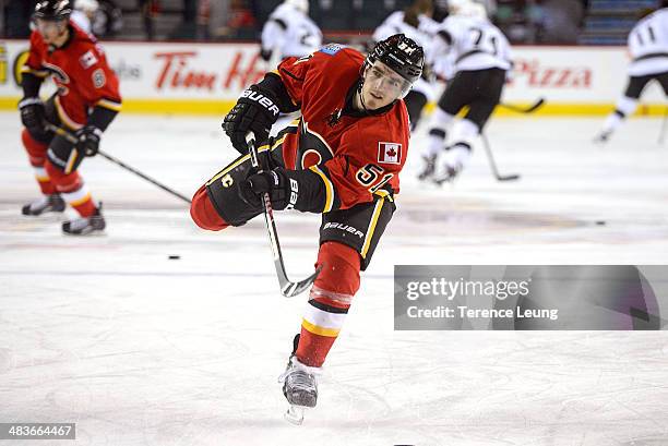 Kenny Agostino of the Calgary Flames skates in the warmup before the game against the Los Angeles Kings at Scotiabank Saddledome on April 9, 2014 in...