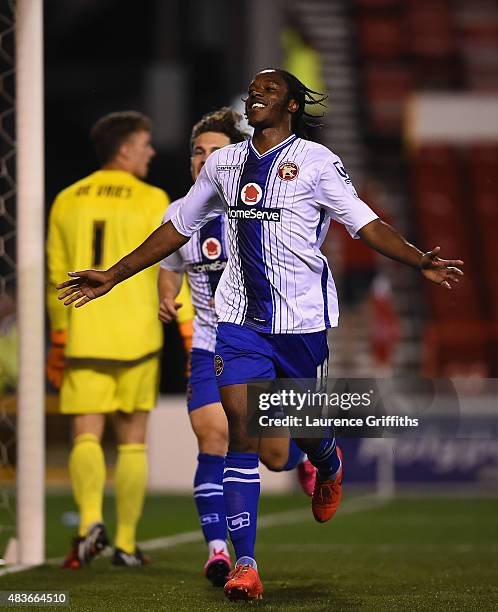 Romanine Sawyers of Walsall celebrates scoring the third goal during the Capital One Cup First Round match between Nottingham Forest and Walsall at...
