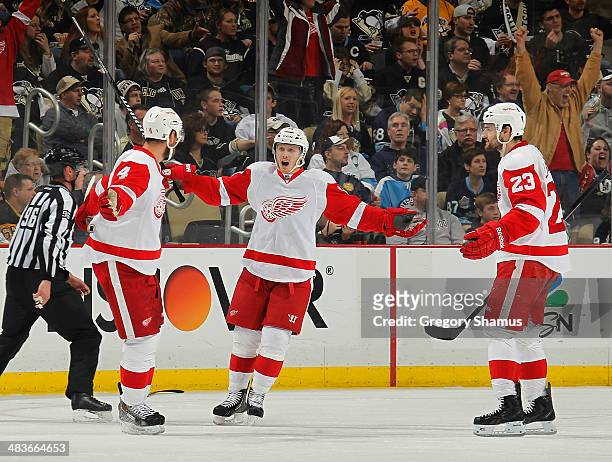 Jakub Kindl celebrates his goal with teammates Gustav Nyquist and Brian Lashoff of the Detroit Red Wings during the second period against the...
