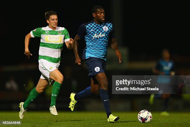 Jay Emmanuel-Thomas of Queens Park Rangers is tracked by Wesley Fogden of Yeovil Towduring the Capital One Cup First Round match between Yeovil Town...