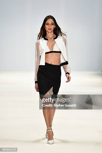 Model walks the runway in a design by Anna Quan at the New Generation show during Mercedes-Benz Fashion Week Australia 2014 at Carriageworks on April...