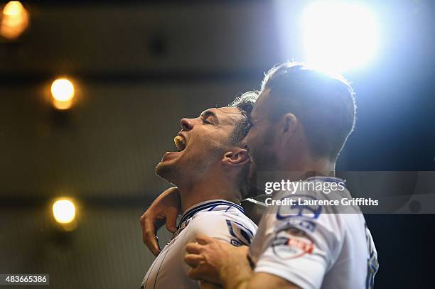 Tom Bradshaw of Walsall celebrates scoring the winning goal during the Capital One Cup First Round match between Nottingham Forest and Walsall at...