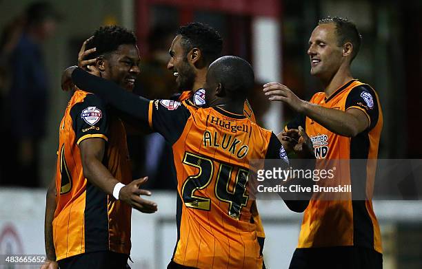 Chuba Akpom of Hull City celebrates with his team mate Ahmed El Mohamady after scoring the first goal in extra time during the Capital One Cup First...