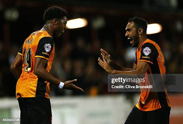 Chuba Akpom of Hull City celebrates with his team mate Ahmed El Mohamady after scoring the first goal in extra time during the Capital One Cup First...