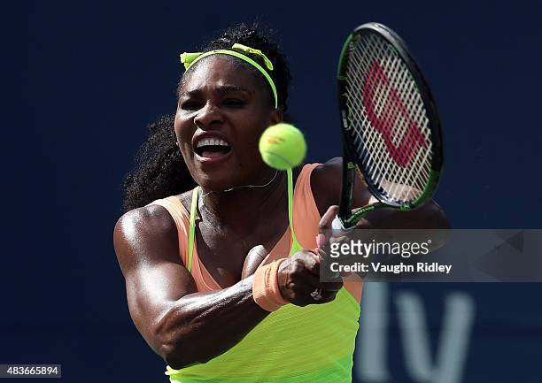 Serena Williams of the USA plays a shot against Flavia Pennetta of Italy during Day 2 of the Rogers Cup at the Aviva Centre on August 11, 2015 in...