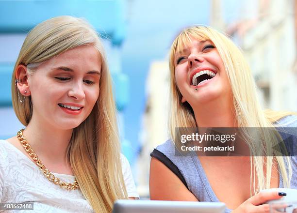 friends interacting with a tablet in a coffee shop - knez mihailova street stock pictures, royalty-free photos & images