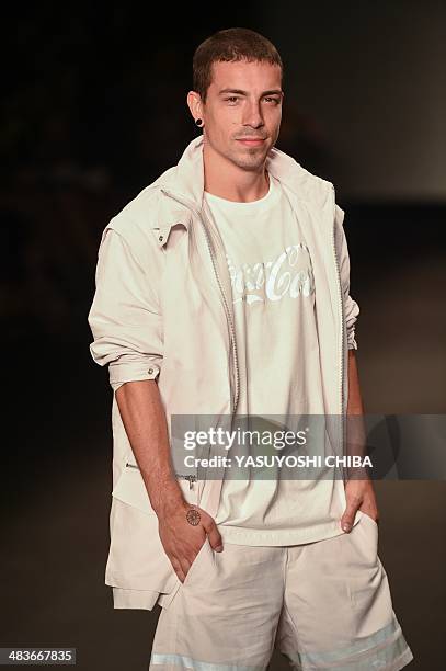 Brazilian musician Di Ferrero presents a creation by Coca-Cola jeans during the Fashion Rio 2015 Summer collection in Rio de Janeiro, Brazil, on...