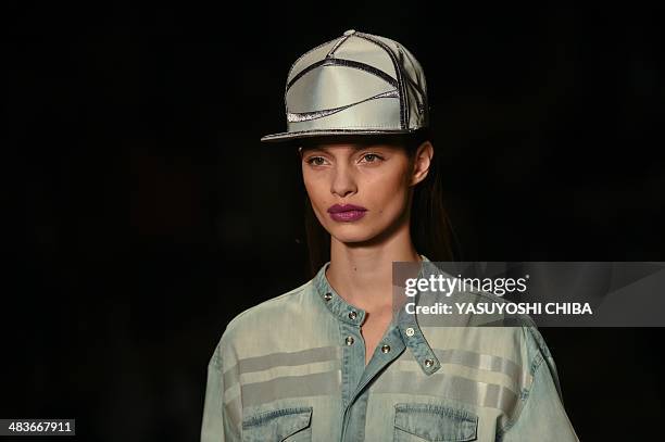 Model presents a creation by Coca-Cola jeans during the Fashion Rio 2015 Summer collection in Rio de Janeiro, Brazil, on April 9, 2014 AFP PHOTO /...