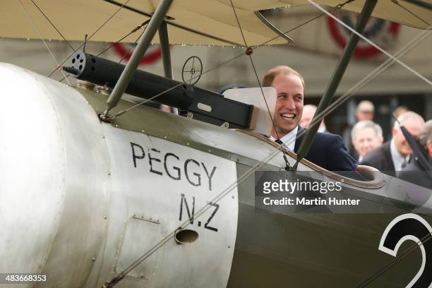 Prince William, Duke of Cambridge sits in a WW1 aircraft during a visit to Omaka Aviation Heritage Centre with Sir Peter Jackson on April 10, 2014 in...