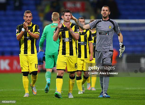 Aurelien Joachim, Calum Butcher and Remi Matthews of Burton Albion celebrate victory after the Capital One Cup first round match between Bolton...