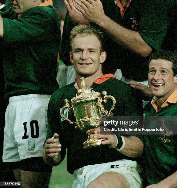 Francois Pienaar, captain of the South Africa rugby union team, with the Webb Ellis trophy after their victory over the New Zealand All Blacks in the...