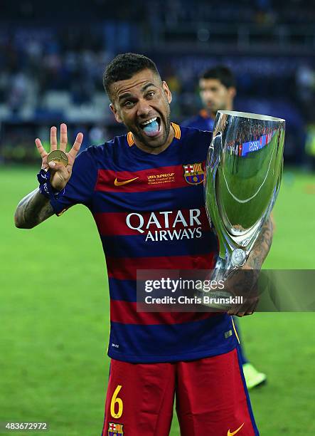 Dani Aleves of Barcelona celebrates with the UEFA Super Cup after the UEFA Super Cup between Barcelona and Sevilla FC at Dinamo Arena on August 11,...