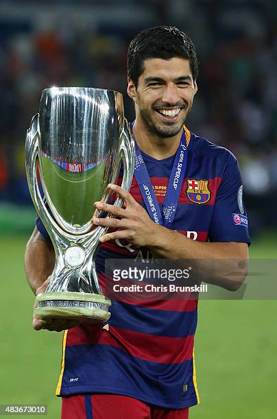 Luis Suarez of Barcelona celebrates with the UEFA Super Cup after the UEFA Super Cup between Barcelona and Sevilla FC at Dinamo Arena on August 11,...