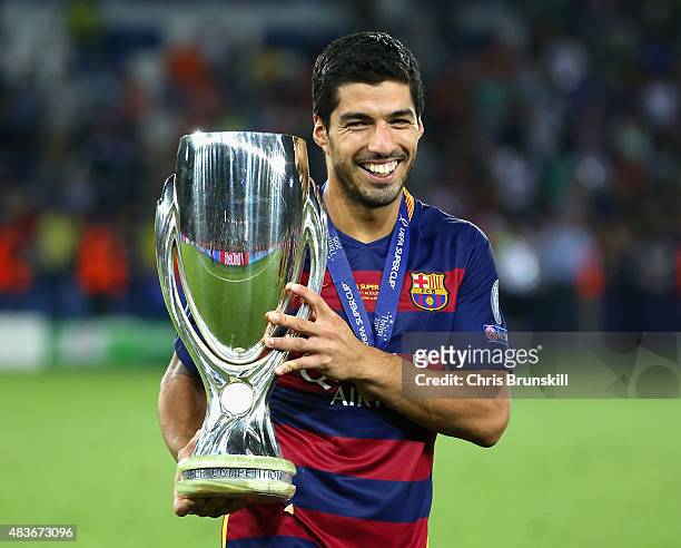 Luis Suarez of Barcelona celebrates with the UEFA Super Cup after the UEFA Super Cup between Barcelona and Sevilla FC at Dinamo Arena on August 11,...