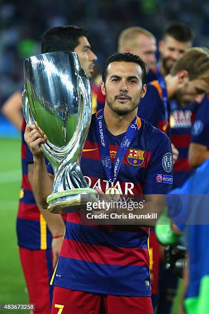 Pedro of Barcelona poses with the UEFA Cup trophy as Barcelona celebrate victoy during the UEFA Super Cup between Barcelona and Sevilla FC at Dinamo...