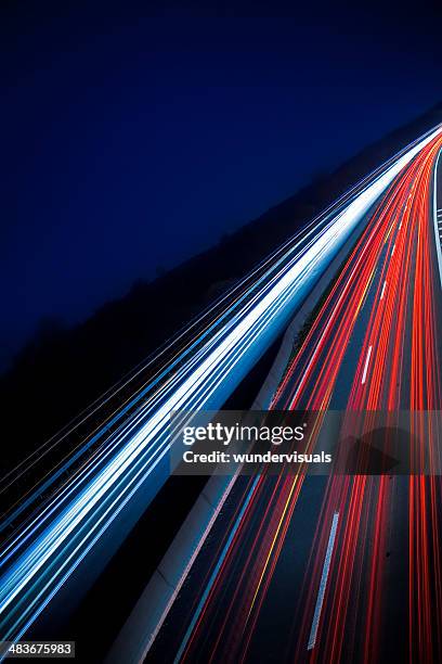 highway at night - long exposure car stock pictures, royalty-free photos & images