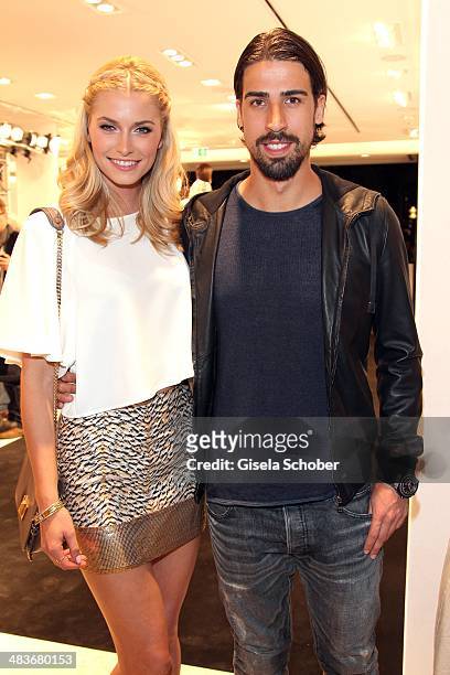 Lena Gercke and Sami Khedira attend the H&M store opening on April 9, 2014 in Munich, Germany.