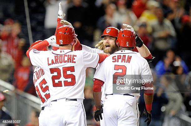 Jayson Werth of the Washington Nationals celebrates with teammates after hitting a grand slam in the eighth inning against the Miami Marlins at...