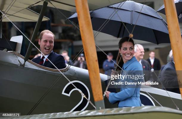 Catherine, Duchess of Cambridge and Prince William, Duke of Cambridge are seen looking at a Sopwith Pup at the "Knights of the Sky" exhibition at...