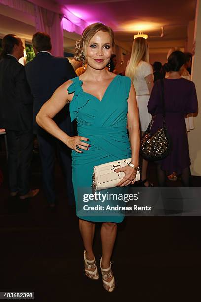 Regina Halmich, dress by Sonja Kiefer, attends the FEI European Championship 2015 media night on August 11, 2015 in Aachen, Germany.