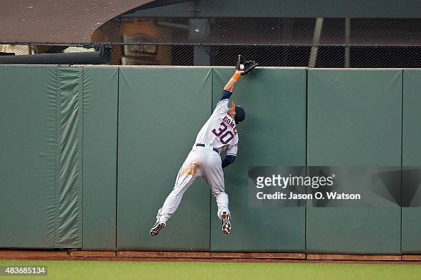 Carlos Gomez of the Houston Astros leaps for and catches a fly ball hit off the bat of Matt Duffy of the San Francisco Giants during the first inning...