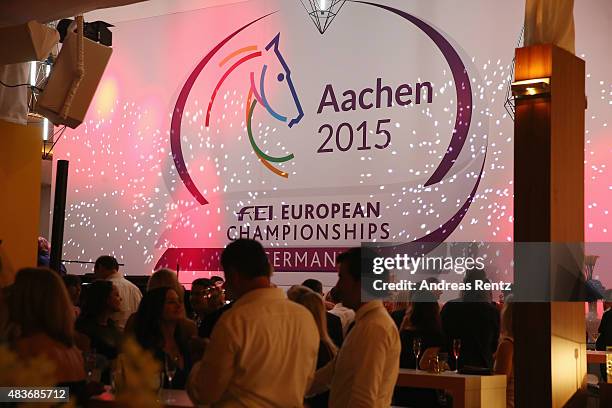 Guests enjoy the atmosphere during the FEI European Championship 2015 media night on August 11, 2015 in Aachen, Germany.