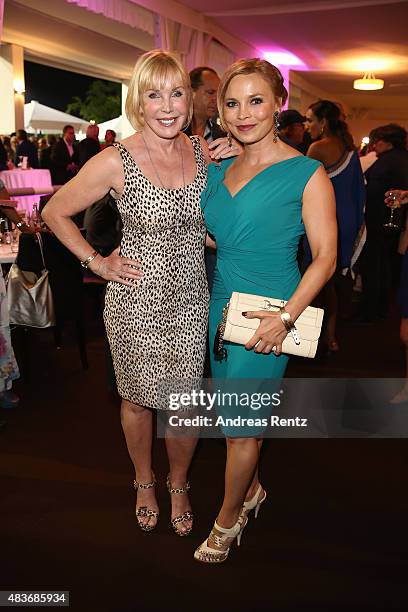 Heike Maurer and Regina Halmich, dress by Sonja Kiefer attend the FEI European Championship 2015 media night on August 11, 2015 in Aachen, Germany.