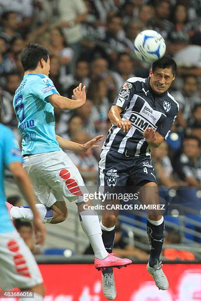 Ricardo Osorio of Monterrey vies for the ball with Hirving Lozano of Pachuca, during their Mexican Apertura 2015 tournament football match on August...
