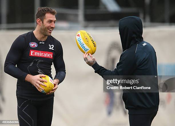 Travis Cloke of the Magpies speaks with Dane Swan during a Collingwood Magpies AFL media session at Westpac Lounge, Westpac Centre on August 12, 2015...