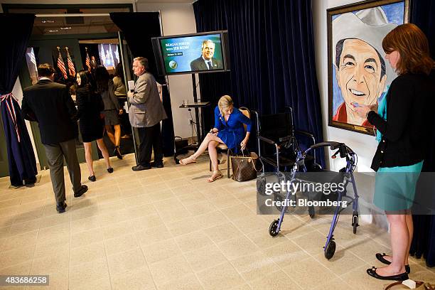 Portrait of former President Ronald Reagan hangs outside as Jeb Bush, former governor of Florida and 2016 Republican presidential candidate, rear,...