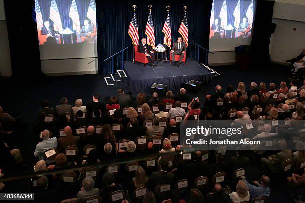 Republican presidential candidate Jeb Bush speaks with former U.S. Ambassador to the U.K. Robert Tuttle at the Ronald Reagan Presidential Library...