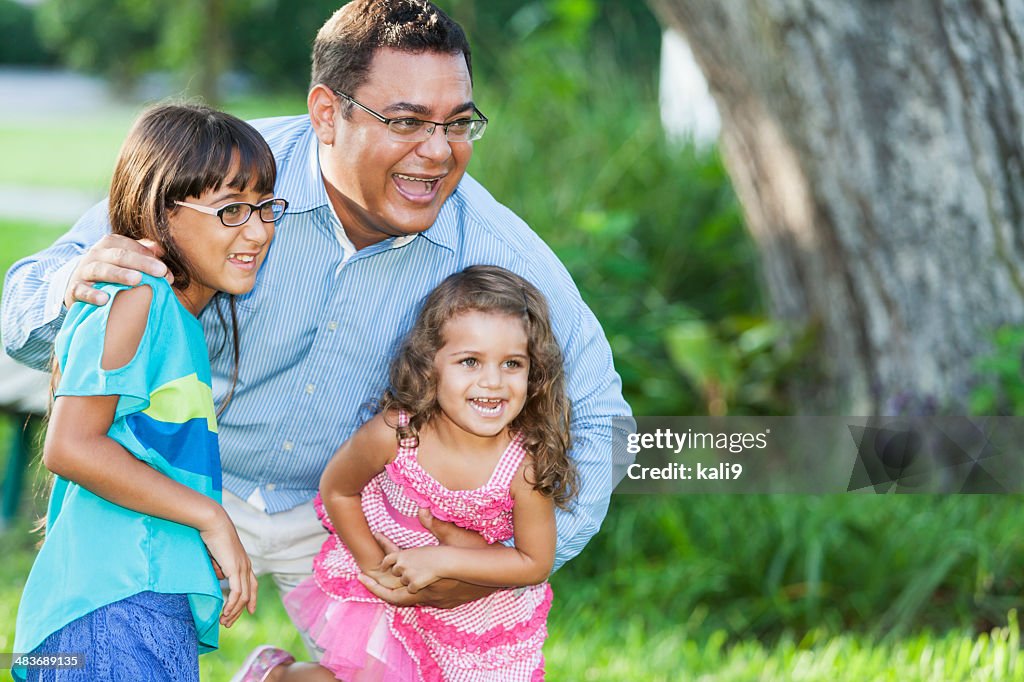 Hispanic father and daughters