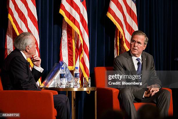 Jeb Bush, former governor of Florida and 2016 Republican presidential candidate, right, speaks with former ambassador Robert Tuttle during an event...