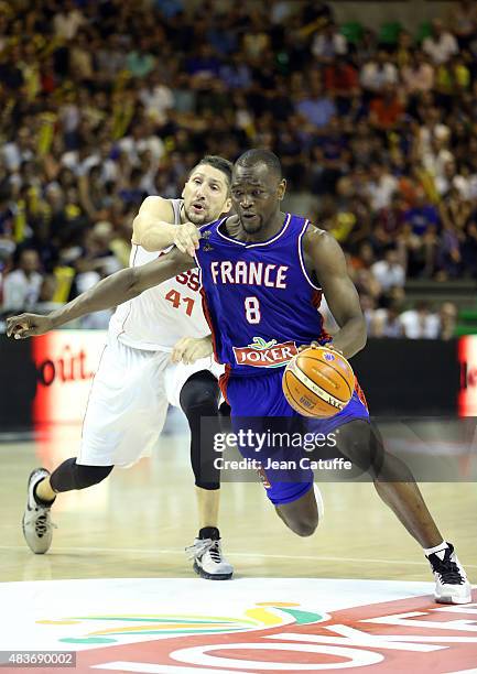 Charles Kahudi of France and Nikita Kurbanov of Russia in action during the international friendly basketball match between France and Russia in...