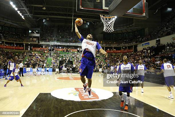 Nicolas Batum of France and teammates warm up before the international friendly basketball match between France and Russia in preparation of Euro...