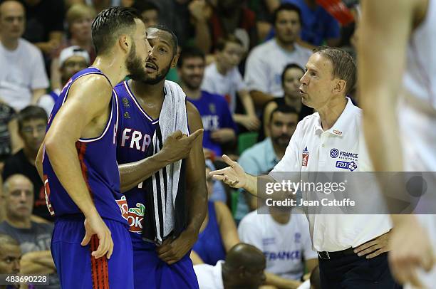 Head coach of France Vincent Collet talks to Joffrey Lauvergne and Boris Diaw of France during the international friendly basketball match between...