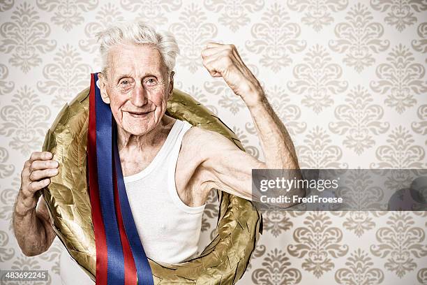 the winner - senior man with golden laurel wreath - buff headwear stock pictures, royalty-free photos & images