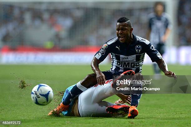 Dorlan Pabon of Monterrey falls to the ground after the slide of Jose Martinez during a 4th round match between Monterrey and Pachuca as part of the...