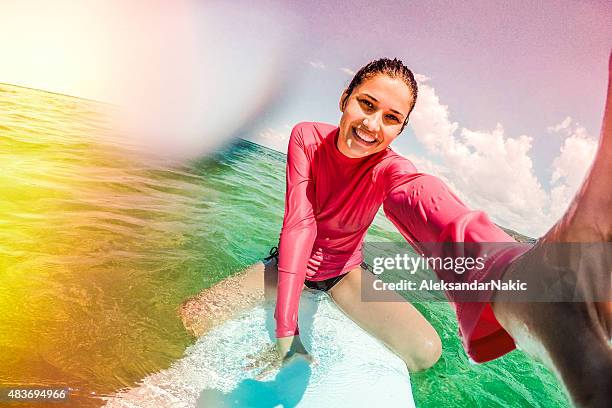 surfer girl making a selfie - surf girl stock pictures, royalty-free photos & images