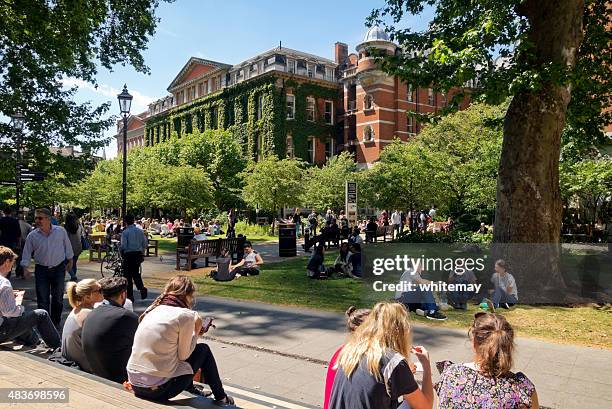 lunchtime near king's college, london - crowded park stock pictures, royalty-free photos & images